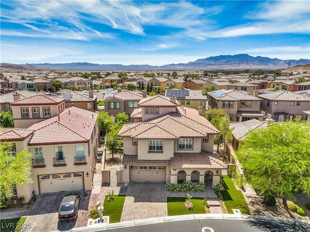 drone / aerial view featuring a mountain view and a residential view