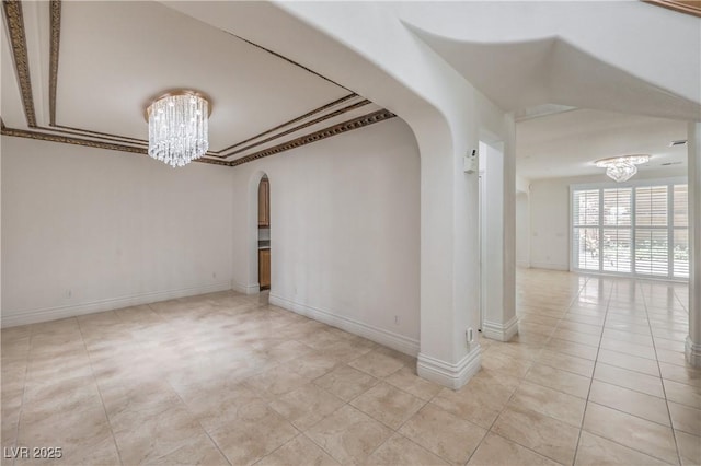 empty room with a chandelier, baseboards, arched walkways, and light tile patterned flooring