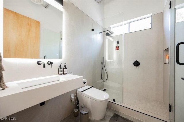 bathroom with walk in shower and toilet
