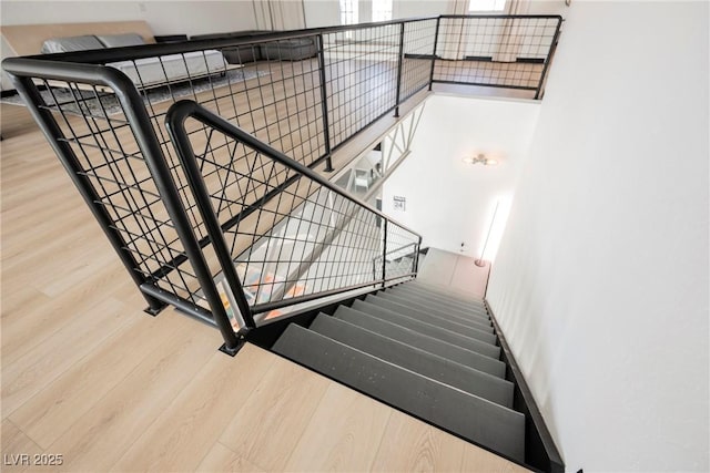 staircase with wood finished floors