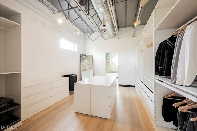 walk in closet featuring light wood-style floors