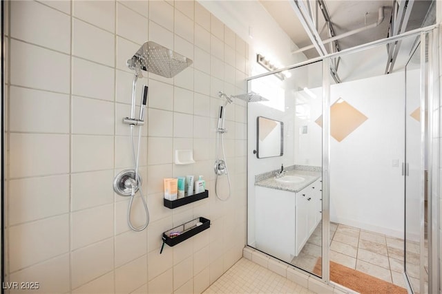 bathroom with vanity and a stall shower