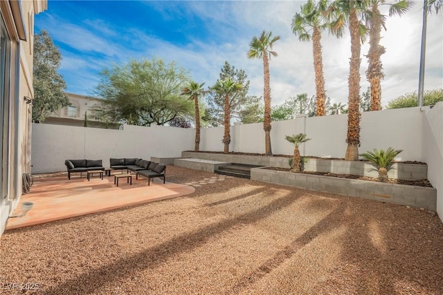 view of yard with a fenced backyard, an outdoor hangout area, and a patio area