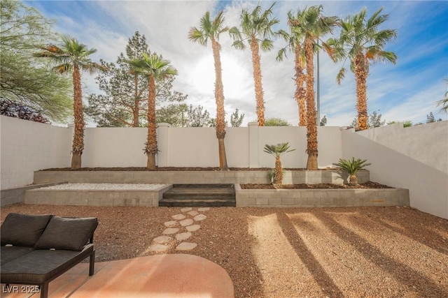 view of yard featuring a patio and a fenced backyard