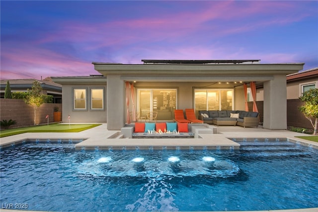 103 Reflection Cove Dr, Henderson, NV 89011 - back of property featuring stucco siding, fence, a fenced in pool, and an outdoor hangout area