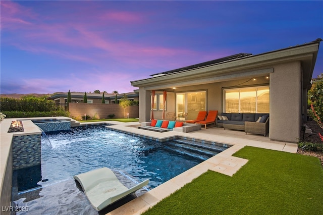 103 Reflection Cove Dr, Henderson, NV 89011 - pool at dusk with an outdoor living space, a patio area, fence, a fenced in pool, and an in ground hot tub