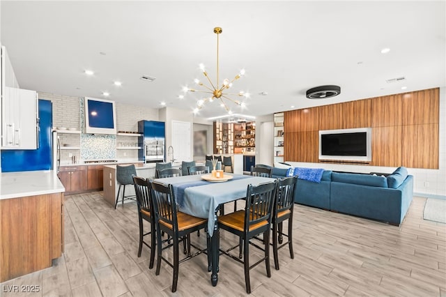 103 Reflection Cove Dr, Henderson, NV 89011 - dining area with recessed lighting, light wood-style flooring, visible vents, and an inviting chandelier