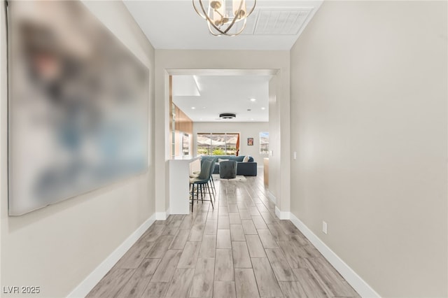 103 Reflection Cove Dr, Henderson, NV 89011 - corridor featuring baseboards, a notable chandelier, visible vents, and light wood-type flooring