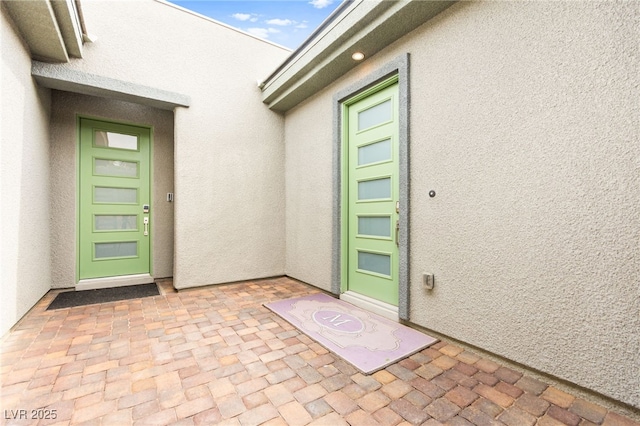 103 Reflection Cove Dr, Henderson, NV 89011 - doorway to property featuring stucco siding