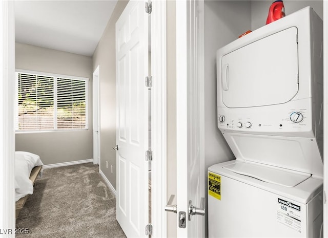 103 Reflection Cove Dr, Henderson, NV 89011 - washroom with baseboards, stacked washer / drying machine, laundry area, and carpet
