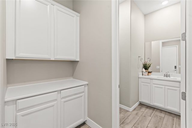 103 Reflection Cove Dr, Henderson, NV 89011 - bathroom featuring baseboards and vanity
