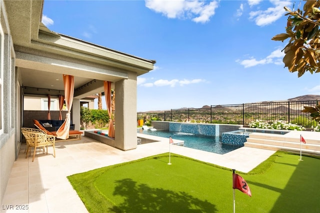 103 Reflection Cove Dr, Henderson, NV 89011 - view of pool featuring a fenced backyard, a patio area, and a pool with connected hot tub