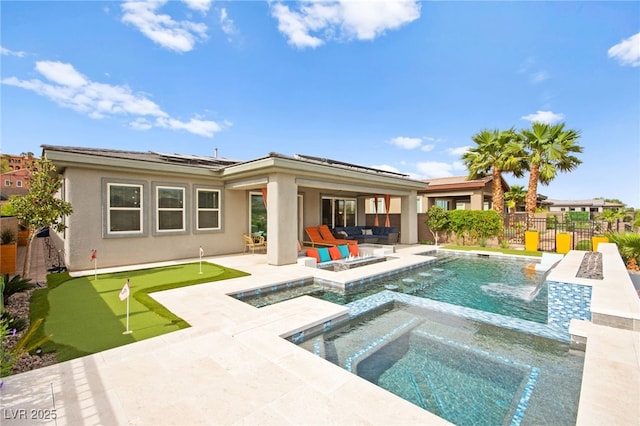 103 Reflection Cove Dr, Henderson, NV 89011 - rear view of property with a patio area, outdoor lounge area, a fenced backyard, stucco siding, and a pool with connected hot tub