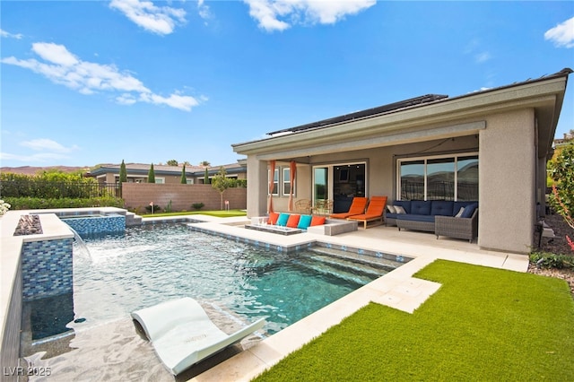 103 Reflection Cove Dr, Henderson, NV 89011 - back of house with a fenced in pool, a fenced backyard, an in ground hot tub, stucco siding, and an outdoor living space