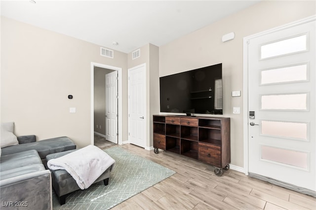 103 Reflection Cove Dr, Henderson, NV 89011 - living area with baseboards, wood finished floors, and visible vents