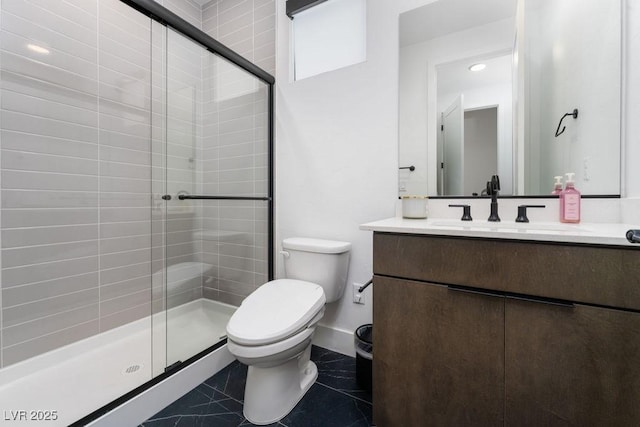 full bath featuring tile patterned floors, toilet, baseboards, a shower stall, and vanity