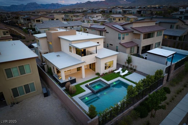 drone / aerial view with a mountain view and a residential view