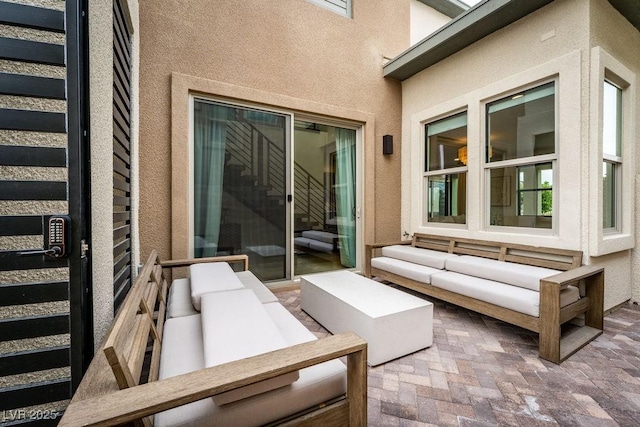 exterior space featuring a patio area and outdoor lounge area