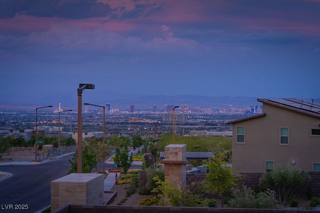 property's view of city with a mountain view