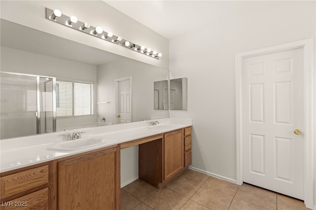 bathroom with a bath, a shower stall, tile patterned flooring, and a sink