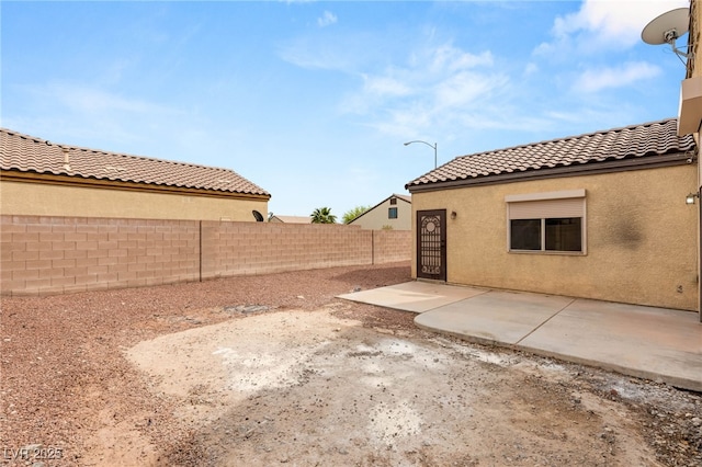view of yard featuring a patio and a fenced backyard