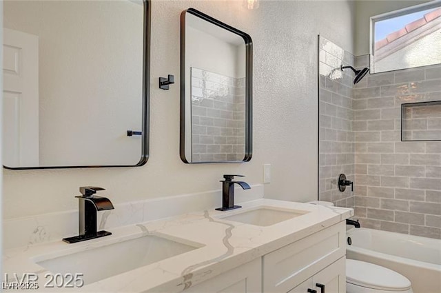 full bath featuring double vanity, toilet, shower / tub combination, and a sink