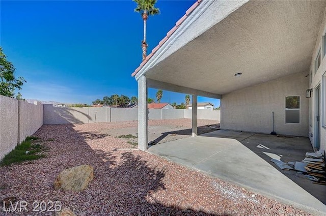 view of yard with a patio area and a fenced backyard