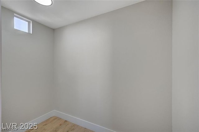interior space with light wood finished floors and baseboards