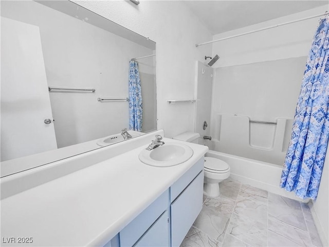 bathroom featuring marble finish floor, toilet, vanity, and shower / bath combination with curtain