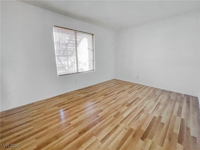unfurnished room featuring light wood finished floors