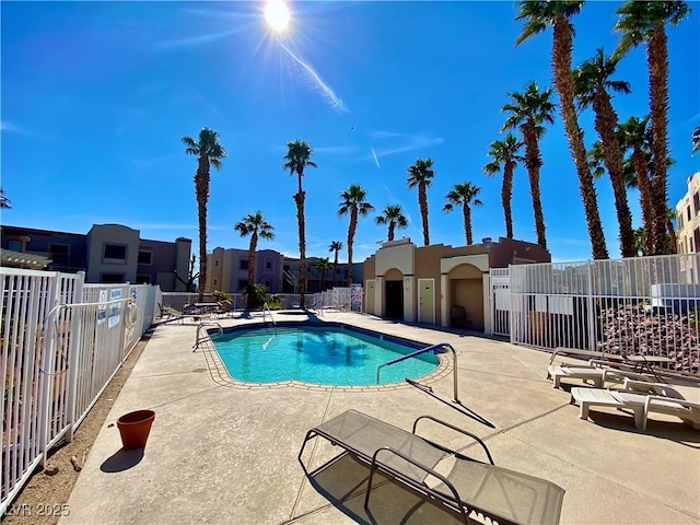 pool featuring a patio area and fence