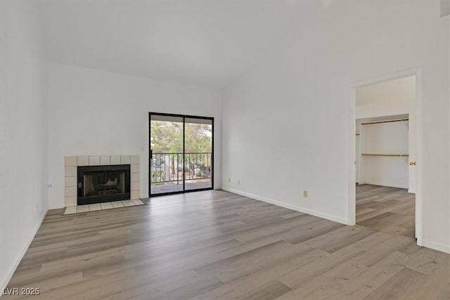 2819 Bluebonnet Dr Unit 6, Henderson, NV 89074 - unfurnished living room with wood finished floors and a tile fireplace