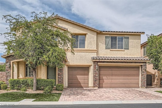 3428 Iron Hagen Ct, Las Vegas, NV 89141 - view of front of house with a garage, stucco siding, and decorative driveway