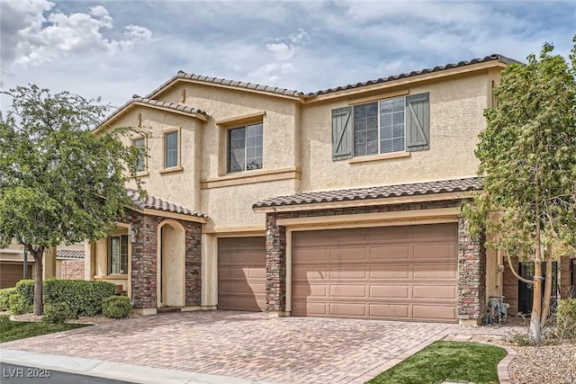 3428 Iron Hagen Ct, Las Vegas, NV 89141 - view of front of house featuring an attached garage, decorative driveway, and a tiled roof