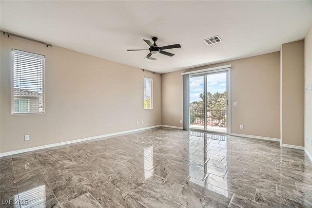 3428 Iron Hagen Ct, Las Vegas, NV 89141 - spare room featuring marble finish floor, baseboards, a ceiling fan, and visible vents