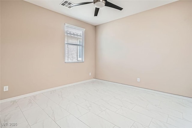 3428 Iron Hagen Ct, Las Vegas, NV 89141 - unfurnished room with visible vents, marble finish floor, baseboards, and ceiling fan
