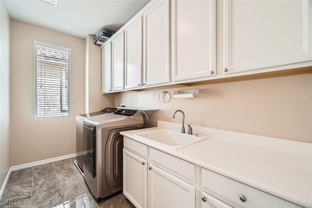 3428 Iron Hagen Ct, Las Vegas, NV 89141 - washroom with separate washer and dryer, baseboards, cabinet space, and a sink