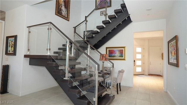 stairs featuring baseboards