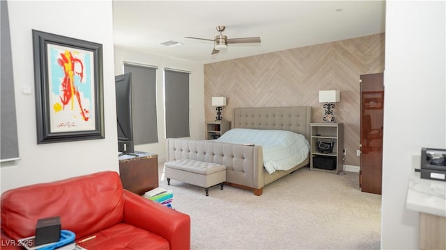 bedroom with visible vents, carpet floors, and ceiling fan