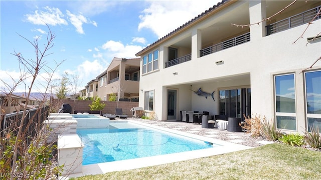 view of swimming pool with a fenced in pool, a patio area, an in ground hot tub, and fence