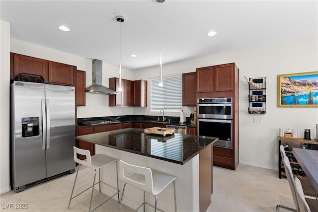 8107 Skye Sweep St, Las Vegas, NV 89166 - kitchen with a breakfast bar area, a kitchen island, wall chimney range hood, pendant lighting, and appliances with stainless steel finishes