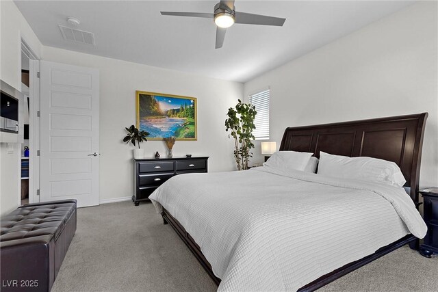 8107 Skye Sweep St, Las Vegas, NV 89166 - bedroom featuring light colored carpet, visible vents, a ceiling fan, and baseboards