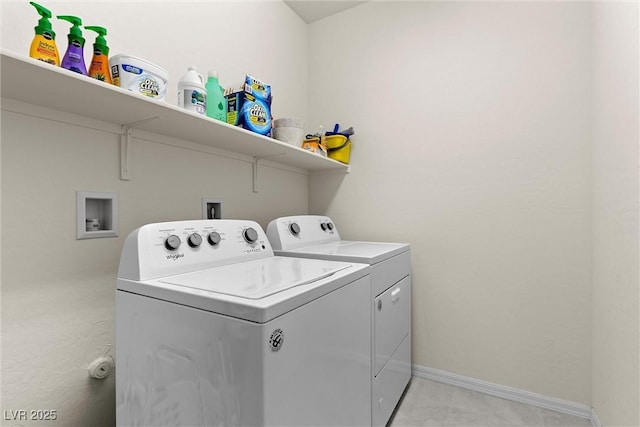 8107 Skye Sweep St, Las Vegas, NV 89166 - laundry area featuring light tile patterned floors, washing machine and clothes dryer, laundry area, and baseboards