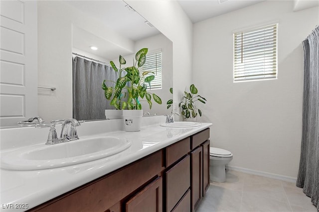 8107 Skye Sweep St, Las Vegas, NV 89166 - bathroom featuring a healthy amount of sunlight, toilet, and a sink