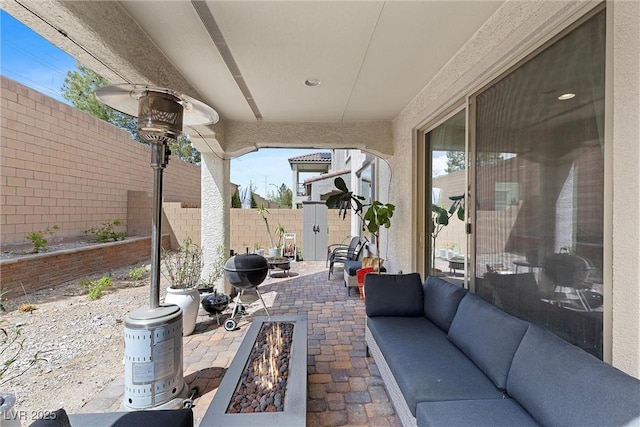 8107 Skye Sweep St, Las Vegas, NV 89166 - view of patio / terrace featuring a fenced backyard and an outdoor living space with a fire pit