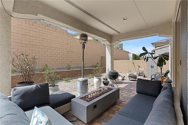 8107 Skye Sweep St, Las Vegas, NV 89166 - view of patio / terrace with a fire pit and a fenced backyard