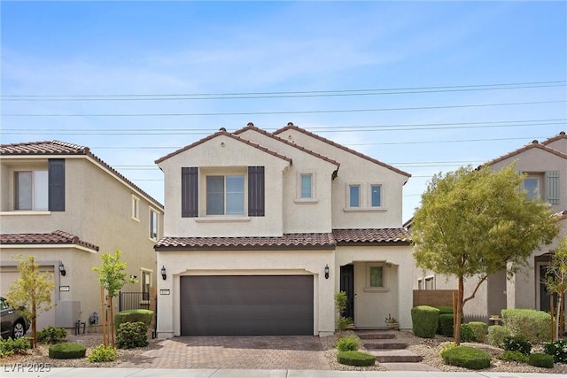 8107 Skye Sweep St, Las Vegas, NV 89166 - mediterranean / spanish home featuring fence, a tile roof, decorative driveway, stucco siding, and a garage