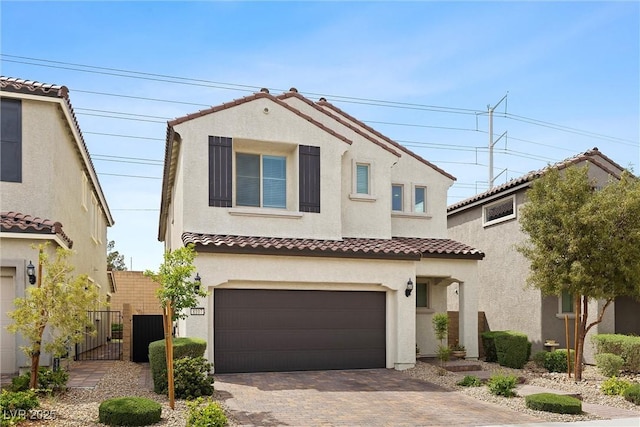 8107 Skye Sweep St, Las Vegas, NV 89166 - mediterranean / spanish-style house featuring a tile roof, a garage, a gate, decorative driveway, and stucco siding