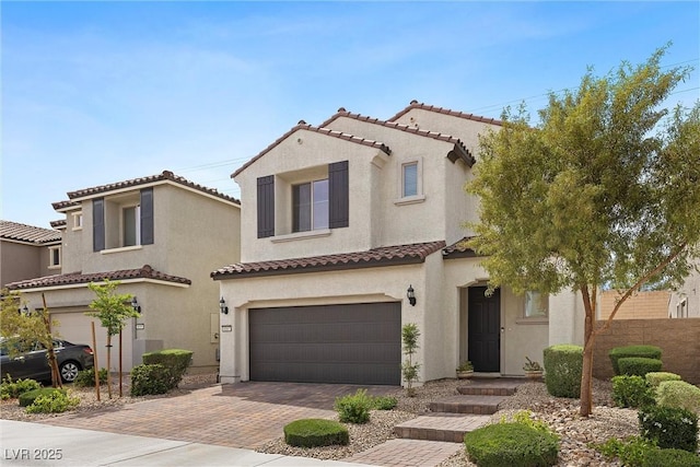8107 Skye Sweep St, Las Vegas, NV 89166 - mediterranean / spanish home featuring stucco siding, decorative driveway, a tiled roof, and a garage