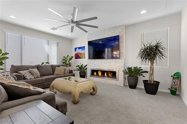 8107 Skye Sweep St, Las Vegas, NV 89166 - living area featuring recessed lighting, a fireplace, ceiling fan, visible vents, and carpet